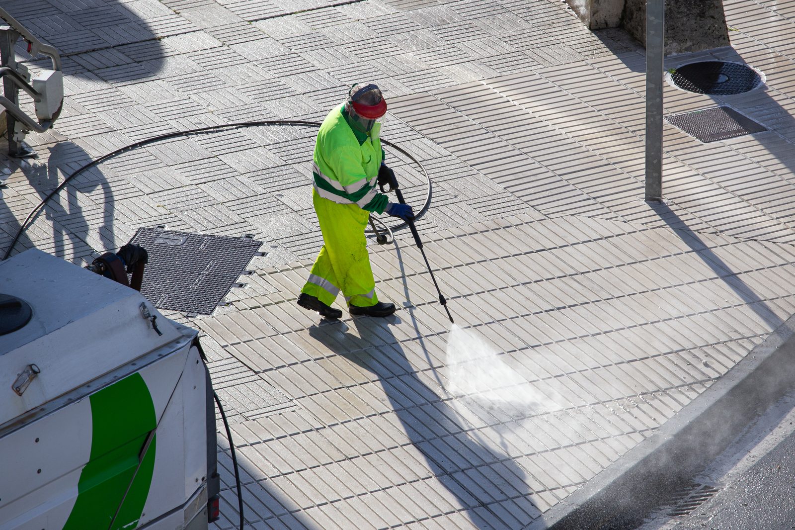 Commercial pavement pressure washing in progress