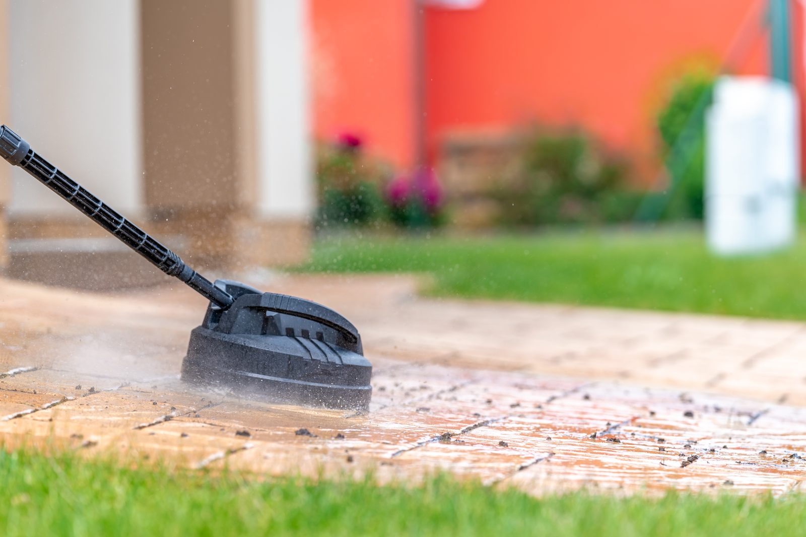 Patio cleaning with a pressure washer surface attachment
