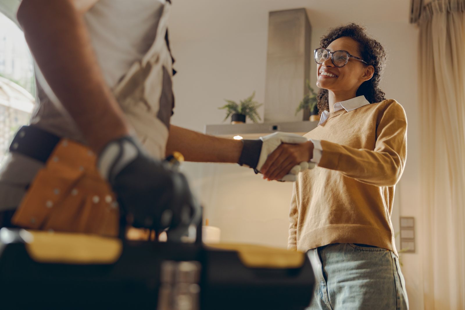 Contractor shaking hands with a homeowner